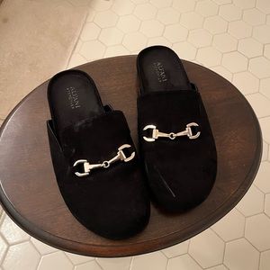 Woman’s black slide suede small scuff mark